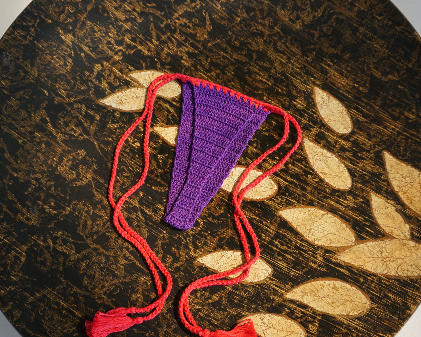 triangle purple and red brazilian crochet bikini set with tassels for swimming flatlay back