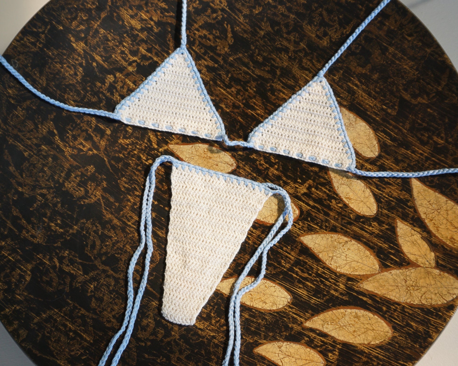 white and blue brazilian crochet bikini set with tassels for swimming flatlay